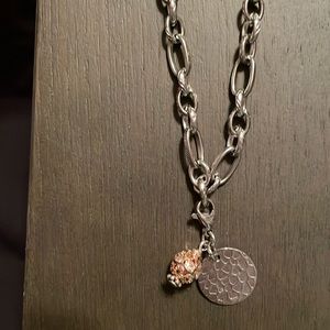 Sims Jewelry Stainless steel necklace with brass & silver metal charms. …